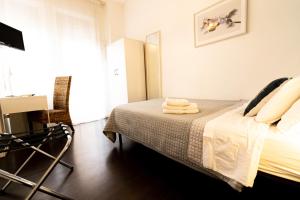 Postel nebo postele na pokoji v ubytování Elisir B & B