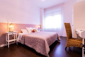 Postel nebo postele na pokoji v ubytování Elisir B & B