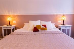 Postel nebo postele na pokoji v ubytování Elisir B & B