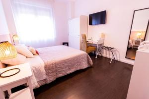 Postel nebo postele na pokoji v ubytování Elisir B & B