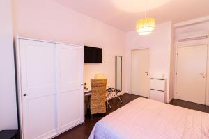 Postel nebo postele na pokoji v ubytování Elisir B & B