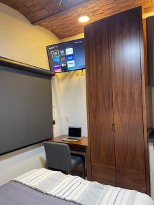 TV a/nebo společenská místnost v ubytování Hotel NG