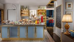 a kitchen with a counter with food on it at ARTIST Boutique Hotel in Vienna
