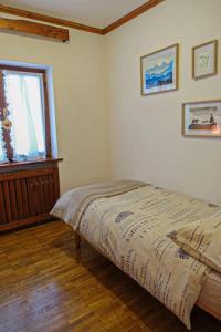 a bedroom with a bed in a room with a window at Relax a Cortina d'Ampezzo - Alverà in Cortina dʼAmpezzo