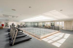 a large swimming pool in a large room with at IL Campanario - Suíte in Florianópolis