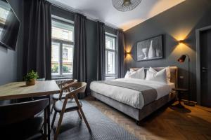 The Viaduct - Suites & More客房内的一张或多张床位