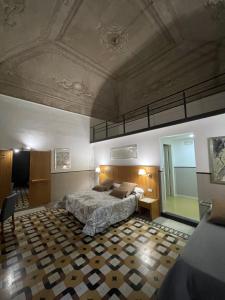 a large bedroom with a bed and a ceiling at Resort CostantiNapoli 27 in Naples