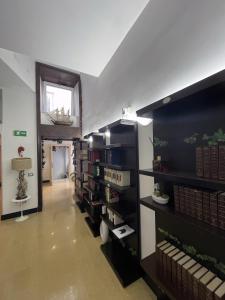 a room with a book shelf with books on it at Resort CostantiNapoli 27 in Naples