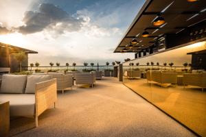 a rooftop patio with couches and a view of the ocean at MOOONS Vienna in Vienna