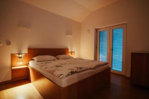 Postel nebo postele na pokoji v ubytování Apartments & Wellness Skok + 37 fotografií