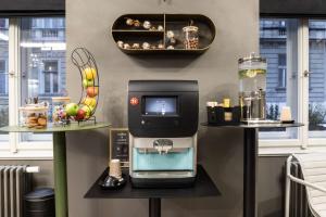 a room with a coffee machine on a shelf at The Viaduct - Suites & More in Prague