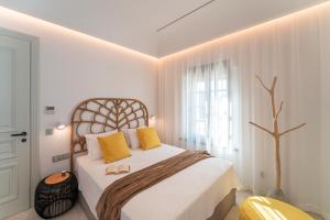 Posteľ alebo postele v izbe v ubytovaní Naillac Elite Suites
