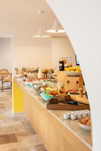 a buffet line with many different types of food at Hôtel Escaletto in Aix-en-Provence +22 photos