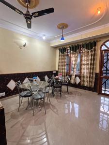 a dining room with tables and chairs and a ceiling at YATIKA HOMESTAY in Shimla