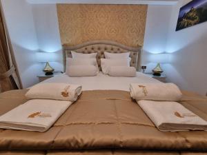 Postel nebo postele na pokoji v ubytování Hotel-Apartment INKASABIOS