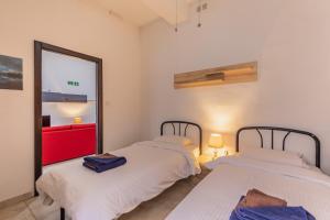 Ένα ή περισσότερα κρεβάτια σε δωμάτιο στο Bormla - Comfortable two bedroom apartment