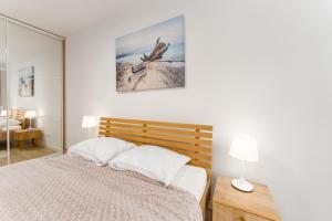 Posteľ alebo postele v izbe v ubytovaní Nadmorskie Tarasy Apartament 215 A Eltom Tour + 7 fotografií