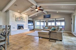 a living room with a couch and a fireplace at Canyon Lake Home Hill Country and Water Views! in Canyon Lake