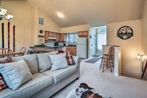 a living room with a couch and a kitchen at Homey Ridgetop Retreat - Walk to Hiking and Biking in Clear Spring