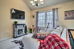 a living room with a couch and a fireplace at Homey Ridgetop Retreat - Walk to Hiking and Biking in Clear Spring