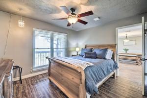 a bedroom with a bed and a ceiling fan at Canyon Lake Home Hill Country and Water Views! in Canyon Lake