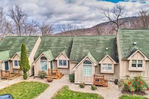 a large house with a green roof at Homey Ridgetop Retreat - Walk to Hiking and Biking in Clear Spring