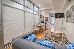 a living room with a couch and a table at Modern Townhome in Historic Dtwn Alexandria! in Alexandria