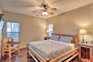 a bedroom with a bed and a ceiling fan at Heber Springs Cabin about 1 Mi to Sugarloaf Mtn! in Heber Springs