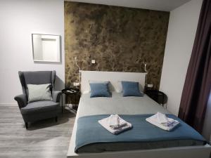 Postel nebo postele na pokoji v ubytování Apartmani Karlo