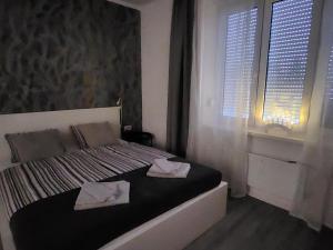 Postel nebo postele na pokoji v ubytování Apartmani Karlo