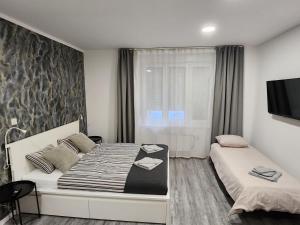 Postel nebo postele na pokoji v ubytování Apartmani Karlo