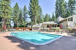 a swimming pool in front of a house at Tahoe Area Townhome with Pool and Mountain Views in Stateline