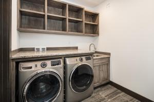 a laundry room with a washer and dryer at 360 Chalet in Big Sky