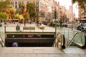 a tunnel in the middle of a city with buildings at Sonder Casa Luz in Barcelona