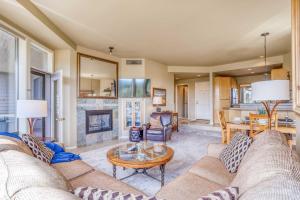 a living room with a couch and a table at River Ridge 332AB in Bend