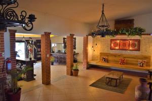 a living room with a table and a fireplace at Hacienda Morelos Beachfront Hotel in Puerto Morelos
