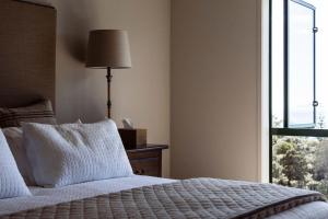 Posteľ alebo postele v izbe v ubytovaní Vineyard Apartment