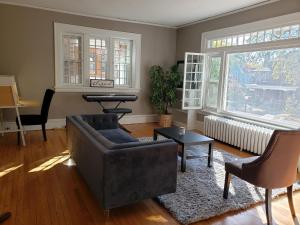 a living room with a couch and a table at The Uptown Oasis in Minneapolis