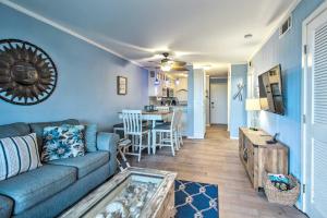 a living room with a couch and a table at Hilton Head Resort Condo with Beach and Pool Access! in Hilton Head Island