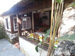 a house with a porch with a bed in it at Casas de 1, 2 e 4 quartos-100m da praia- com AC-WIFI-Estac in Camburi