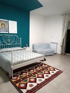 Ένα ή περισσότερα κρεβάτια σε δωμάτιο στο El Pibe de Oro - Casa Vacanze