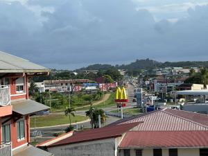 a city with a mcdonalds sign in the middle of a town at NANA COCOONING- C42- Vue Panoramique - Appartement Cosy et Lumineux- Cuisine équipée- CLIM-Terrasse in Cayenne