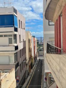 a view of a city street from a building at Renovated modern apartment in the city center in Santa Cruz de Tenerife