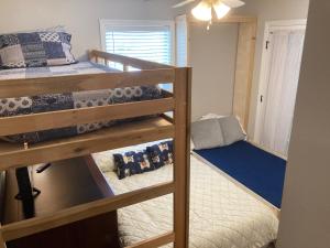 a bedroom with two bunk beds and a desk at Spacious 3 Bedroom 2 bath Condo close to Five-points in Athens in Athens