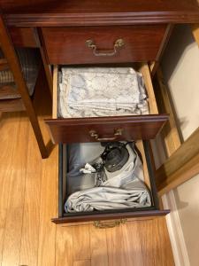 a drawer in a table with a camera in it at Spacious 3 Bedroom 2 bath Condo close to Five-points in Athens in Athens