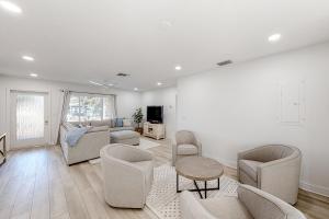 a living room with a couch and chairs at Paradise Found in Clearwater Beach +35 photos