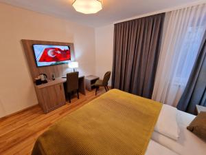 TV a/nebo společenská místnost v ubytování Sophien Hotel
