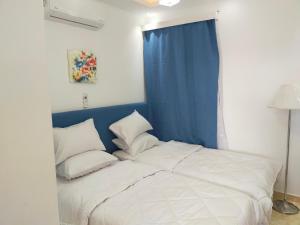 A bed or beds in a room at Red Sea Panorama