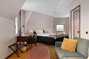 Postel nebo postele na pokoji v ubytování Best Western Plus Grand Hotel