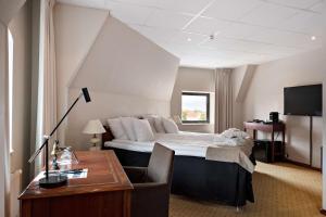 Postel nebo postele na pokoji v ubytování Best Western Plus Grand Hotel